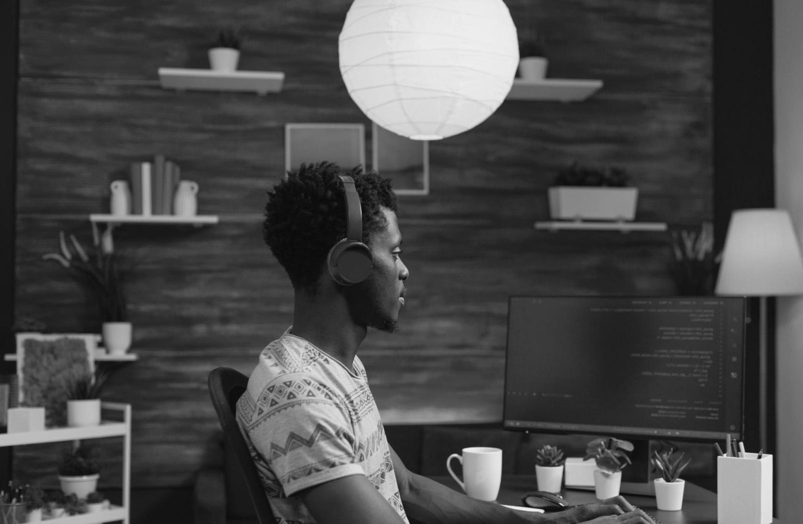 Students collaborating on web interface design projects in modern learning environment