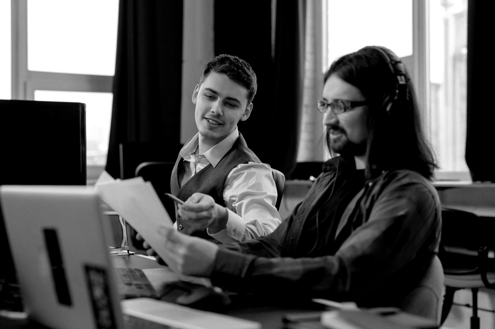 Students collaborating on design projects in modern classroom setting