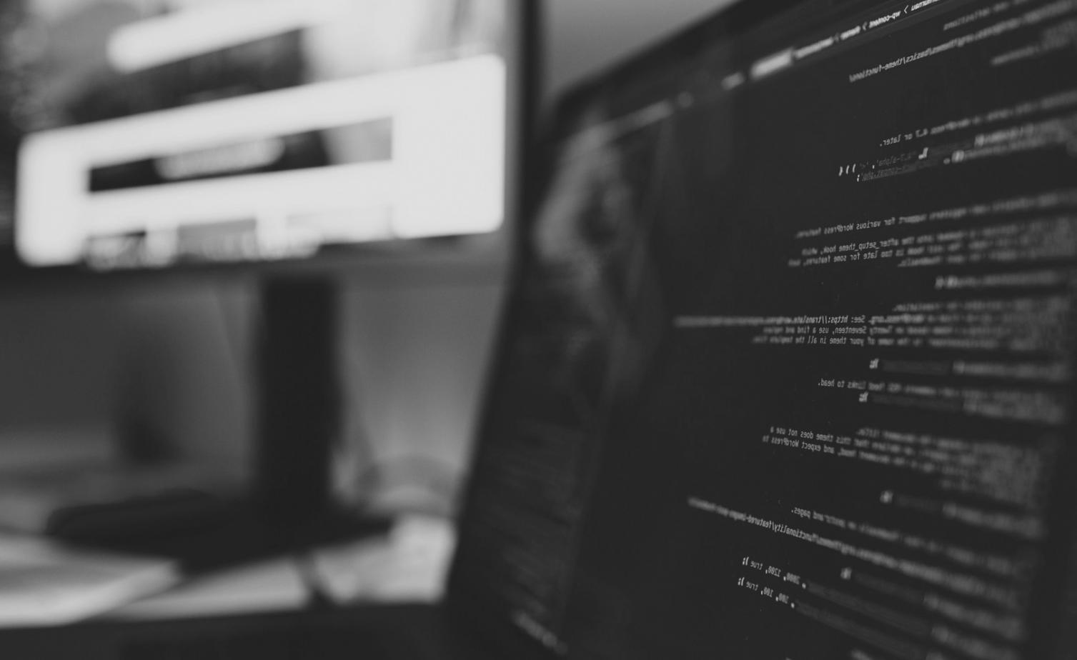 Successful WebDevCurrent graduates working together at a modern Taiwan tech company office